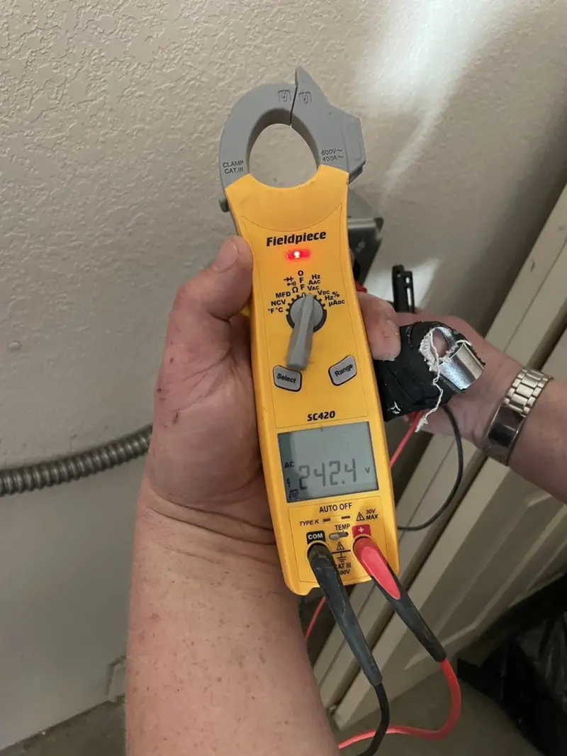 Voltage testing with clamp meter during Generator Installation in Winfield